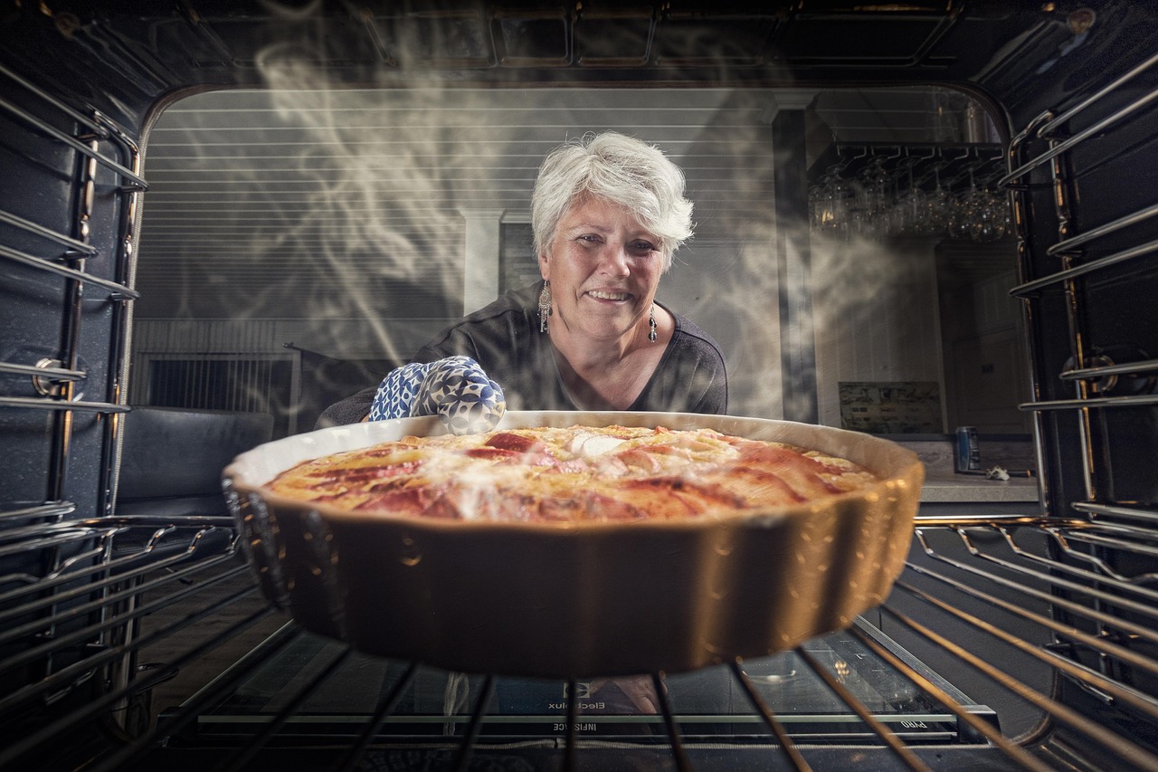 Someone smiling while baking in the kitchen
